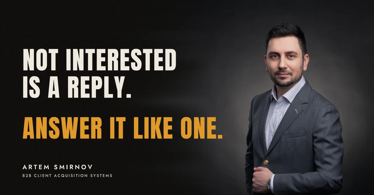 Artem Smirnov in a dark suit against a charcoal studio backdrop, next to the line 'Not interested is a reply. Answer it like one.'
