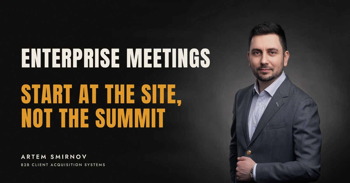 Artem Smirnov in a dark suit against a charcoal studio backdrop, next to the line 'ENTERPRISE MEETINGS. Start at the site, not the summit'