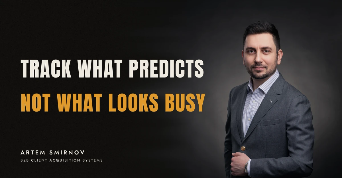 Artem Smirnov in a dark suit against a charcoal studio backdrop, next to the line 'TRACK WHAT PREDICTS. Not what looks busy'