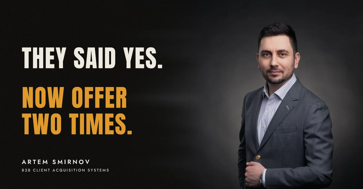 Artem Smirnov in a dark suit against a charcoal studio backdrop, next to the line 'They said yes. Now offer two times.'