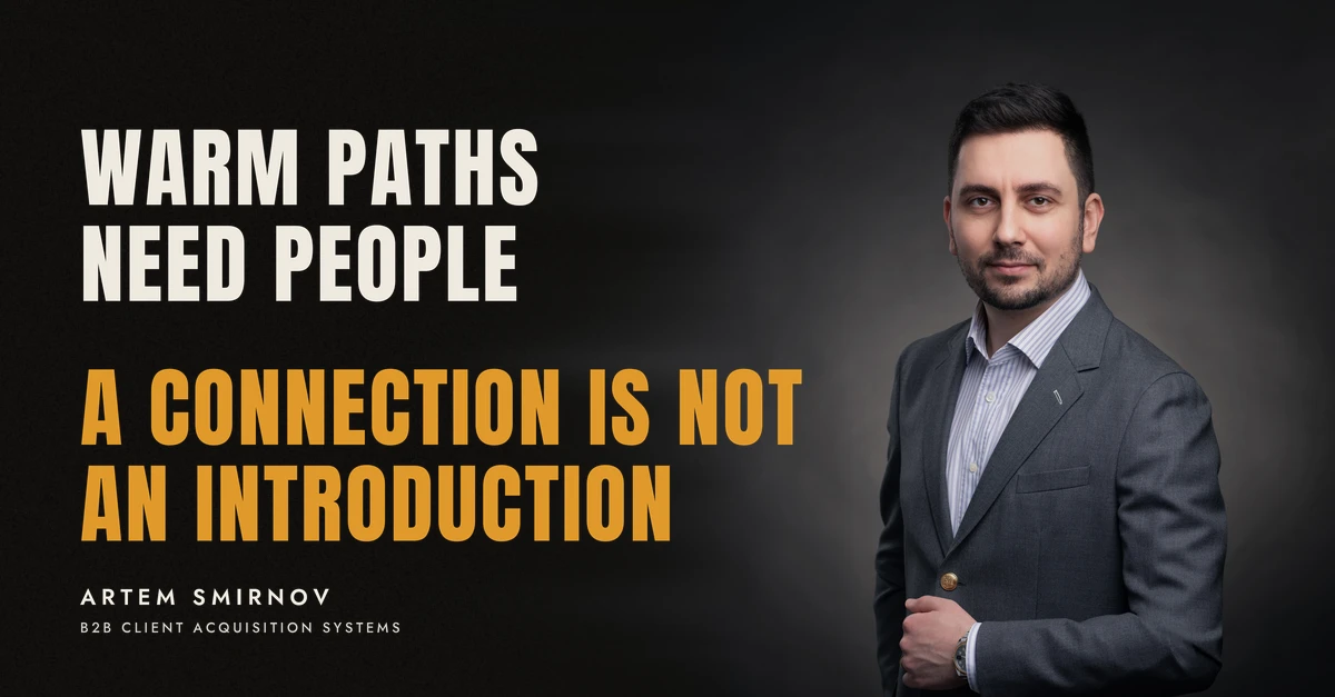 Artem Smirnov in a dark suit against a charcoal studio backdrop, next to the line 'WARM PATHS NEED PEOPLE. A connection is not an introduction'