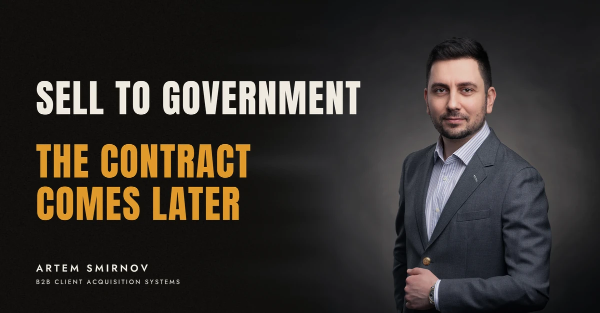 Artem Smirnov in a dark suit against a charcoal studio backdrop, next to the line 'SELL TO GOVERNMENT. The contract comes later'