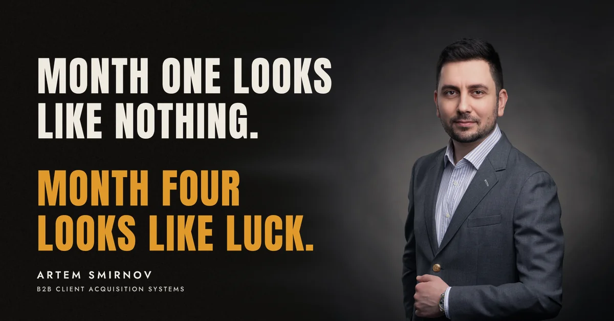 Artem Smirnov in a dark suit against a charcoal studio backdrop, next to the line 'Month one looks like nothing. Month four looks like luck.'